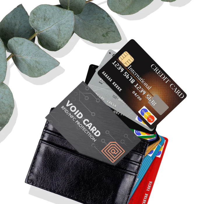 Person inserting RFID protector into wallet with secure vibes